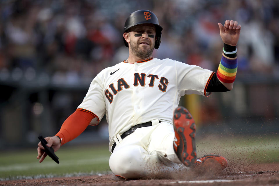 San Francisco Giants' Evan Longoria scores on a Brandon Crawford double during the fifth inning of a baseball game against the Chicago Cubs on Saturday, June 5, 2021, in San Francisco. (AP Photo/Scot Tucker)