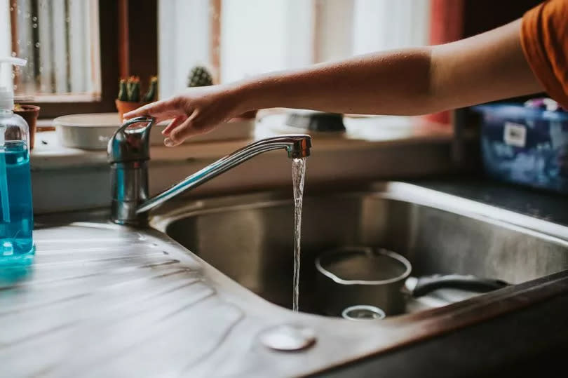 a kitchen tap running