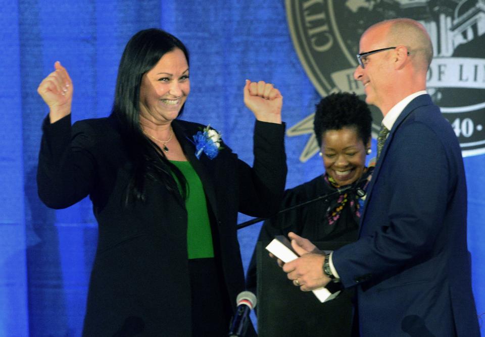 City Treasurer Colleen Redpath Feger, left, celebrates after being sworn in during the City of Springfield Inauguration Ceremony at the Bank of Springfield Center on Friday, May 5, 2023. At right is her husband, Josh Feger. Illinois Supreme Court Justice Lisa Holder White performed the swearing in for city officials.