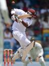 West Indies cricketer Narsingh Deonarine plays a shot during the second day of the first-of-three Test matches between Australia and West Indies at the Kensington Oval stadium in Bridgetown on April 8, 2012. AFP PHOTO/Jewel Samad (Photo credit should read JEWEL SAMAD/AFP/Getty Images)