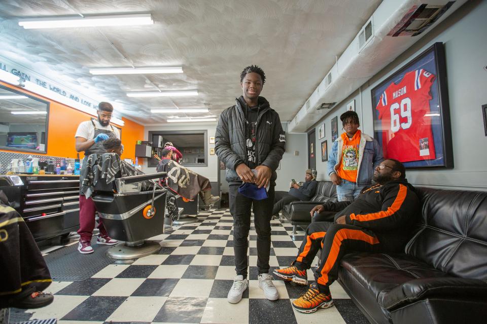 Jaidyn Phillips Booker, 14, stands inside Finishing Touch Barber Shop in Columbia, Tenn., on Friday, Jan. 28, 2022.