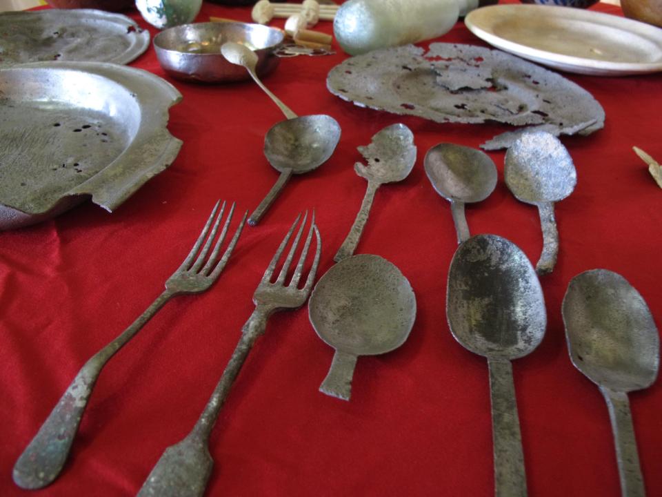 Silver forks, pewter cups, ceramic dishes, ornate smoking pipes and other artifacts collected by underwater archaeologists from the remains of the submerged Jamaican city of Port Royal, are shown to the media during a press conference in Port Royal, Jamaica, Tuesday, May 29, 2012. A team of international archaeologists said Tuesday that they’ll ask the United Nations’ cultural agency to bestow world heritage status on Port Royal, the mostly submerged remains of a historic Jamaican port known as the “wickedest city on Earth” more than three centuries ago. (AP Photo/David McFadden)