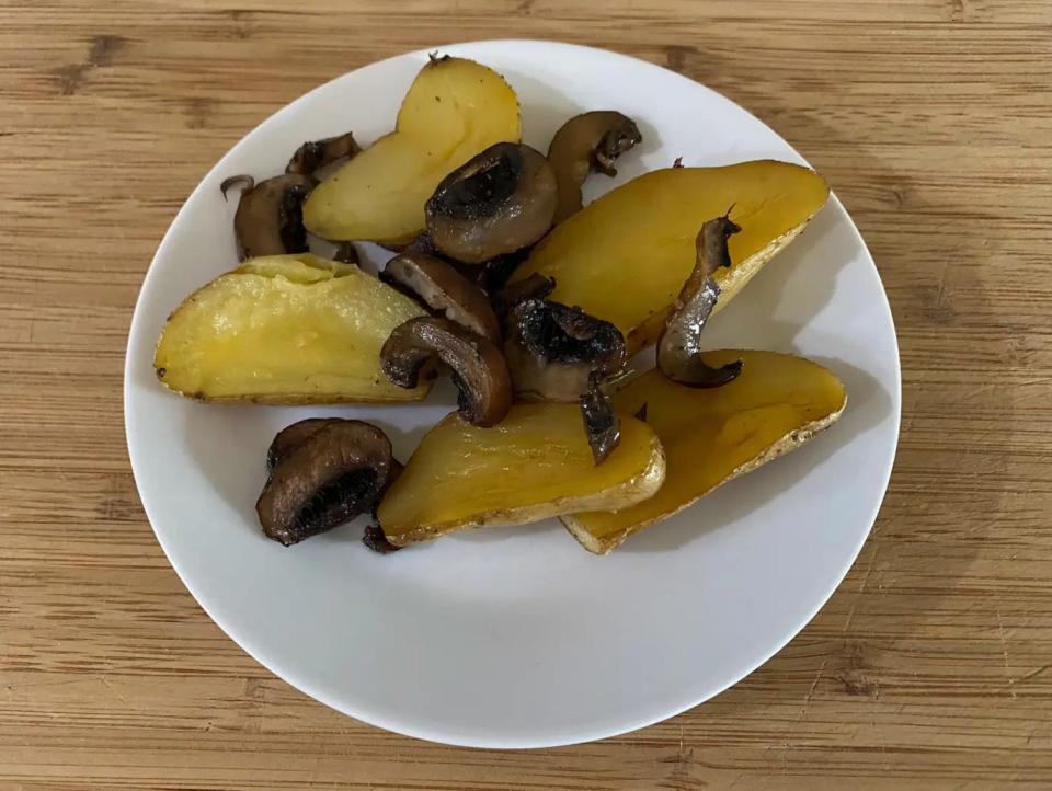 roasted mushrooms and potatoes on a white plate