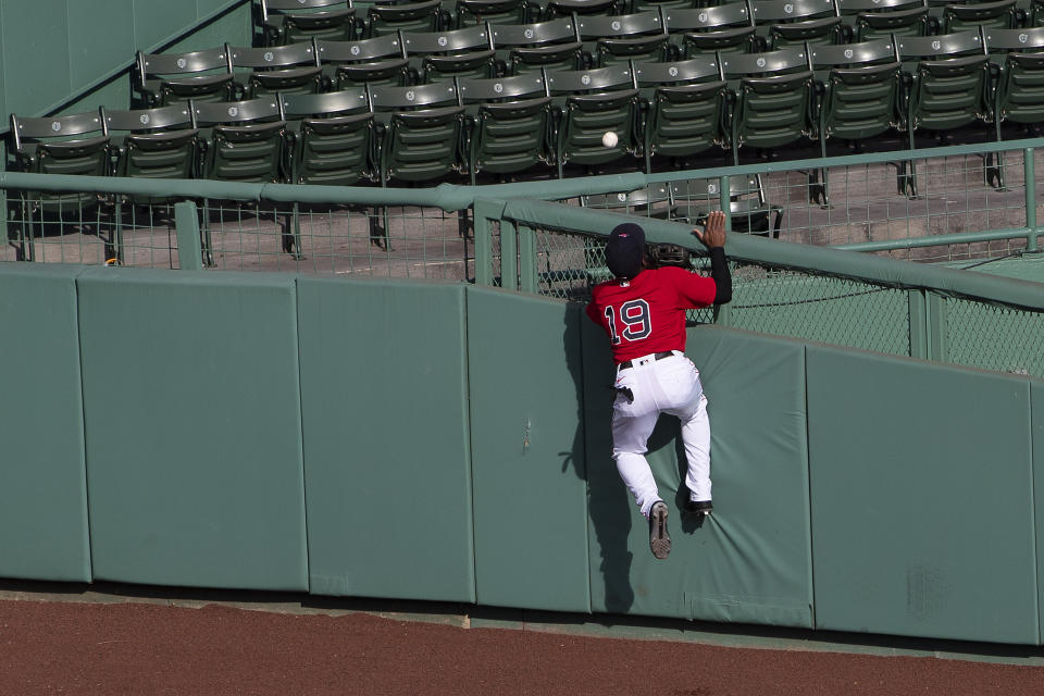 Boston Red Sox center fielder Jackie Bradley Jr. cannot get to a home run by Toronto Blue Jays' Travis Shaw during the second inning of the first game of a baseball doubleheader Friday, Sept. 4, 2020, at Fenway Park in Boston. (AP Photo/Winslow Townson)