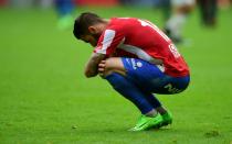 Sporting Gijon's Lillo Castellano crouches at the end of their match against Real Madrid at El Molinon stadium in Gijon on April 15, 2017