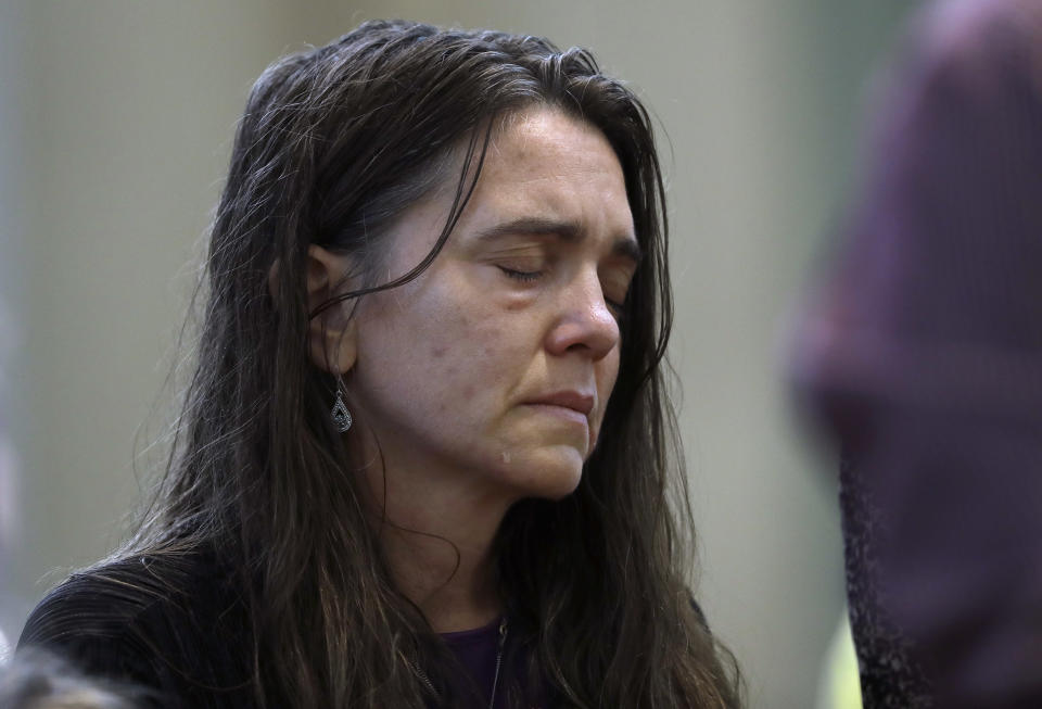 A parishioner attends mass celebrated by Bishop Ronald Gainer, of the Harrisburg Diocese, at the Cathedral Church of Saint Patrick in Harrisburg, Pa., Friday, Aug. 17, 2018. The grand jury report released this week found rampant sexual abuse of more than 1,000 children by about 300 priests in six Pennsylvania dioceses over seven decades. It criticized Gainer for advocating to the Vatican that two abusive priests not be defrocked. (AP Photo/Matt Rourke)