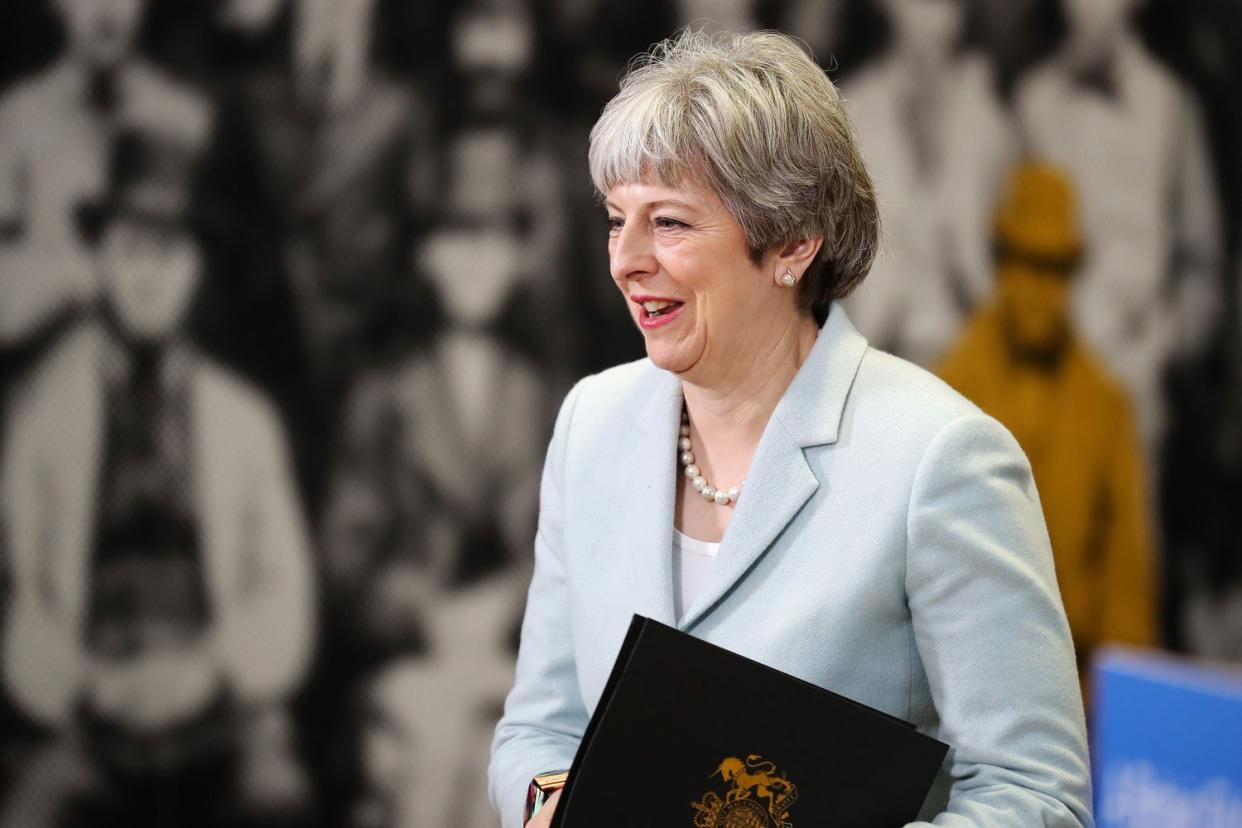 British Prime Minister Theresa May arrives to deliver her speech on universities: Getty