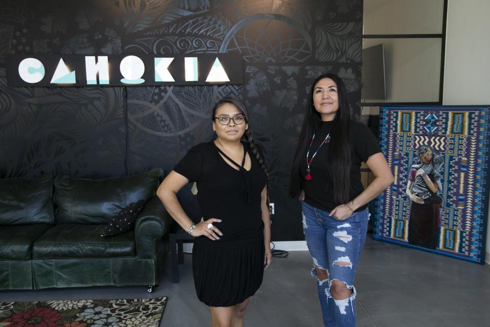 Cahokia co-founders, Eunique Yazzie, left, of the Navajo Nation and Melody Lewis, who is Hopi, Tewa and Mojave, are seen at Cahokia, a new Indigenous-led social, tech and art working space in Phoenix on Oct. 4, 2021.