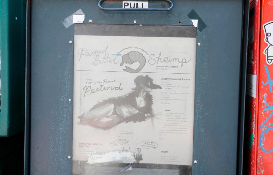 The Peanut Butter Shrimp literary newspaper on display in a box near Brighter Day.