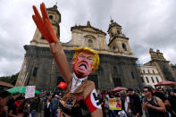 <p>Protesters carry a cutout depicting U.S. President Donald Trump, wearing a Nazi uniform, during a rally commemorating May Day in Bogota, Colombia May 1, 2018. (Photo: Jaime Saldarriaga/Reuters) </p>