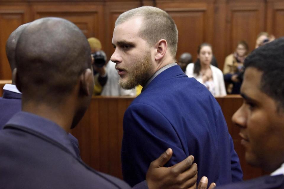 Henri van Breda is led out of the High Court in Cape Town, South Africa, on Monday (AP)