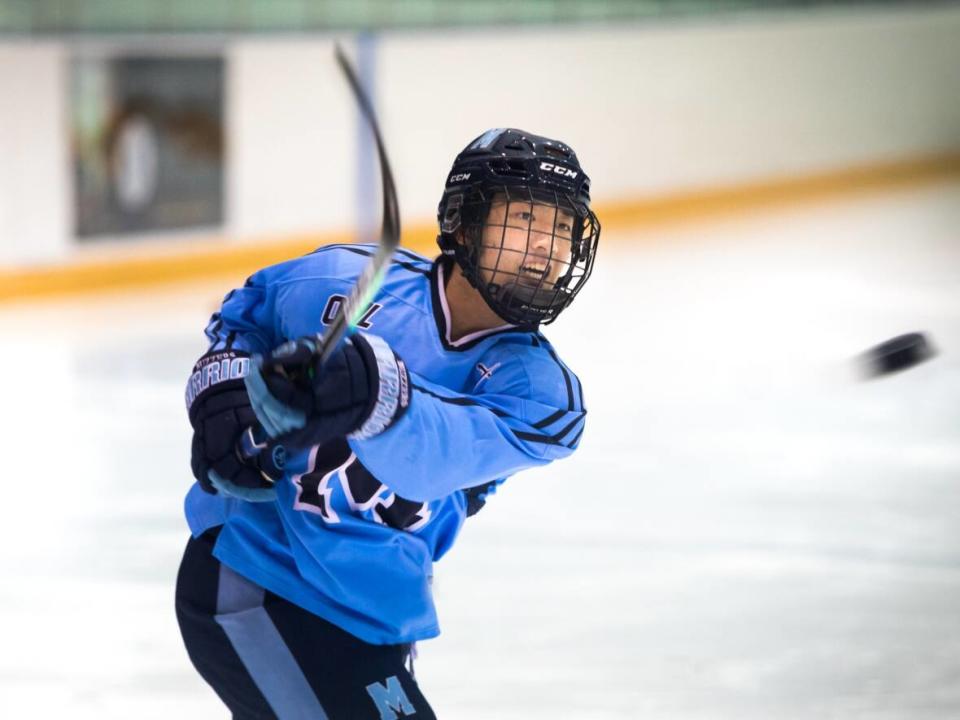 Kailin Chen of the St. Michael's Buzzers moved to Canada with his family six years ago for opportunities to train and pursue a hockey career impossible to find in his native China. (Saša Petricic/CBC - image credit)