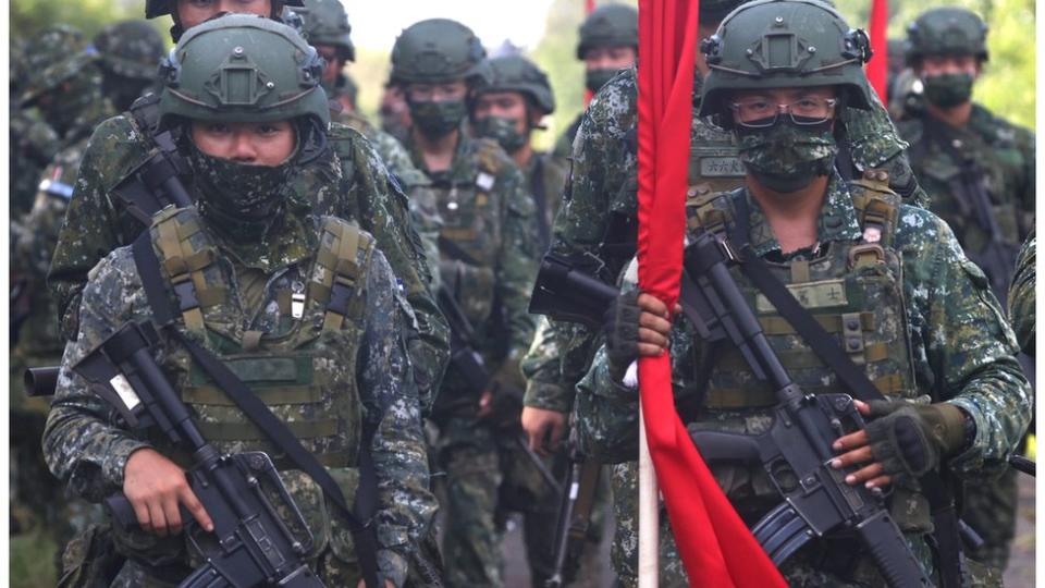 Soldiers march to position during an anti-invasion drill on the beach during the annual Han Kuang military drill in Tainan