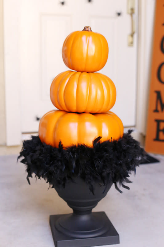 <p>See Vanessa Craft</p><p>Let guests know what they’re in for before they even open the front door with this spooky topiary idea from <a href="https://seevanessacraft.com/2017/09/halloween-stacked-pumpkin-topiary/" rel="nofollow noopener" target="_blank" data-ylk="slk:See Vanessa Craft;elm:context_link;itc:0;sec:content-canvas" class="link ">See Vanessa Craft</a>.</p>