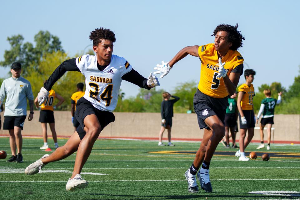 Defensive back, Cole, Shivers, 5, practices with the Sabercats football on the Saguaro High School football field on May 2, 2022 in Scottsdale, AZ.