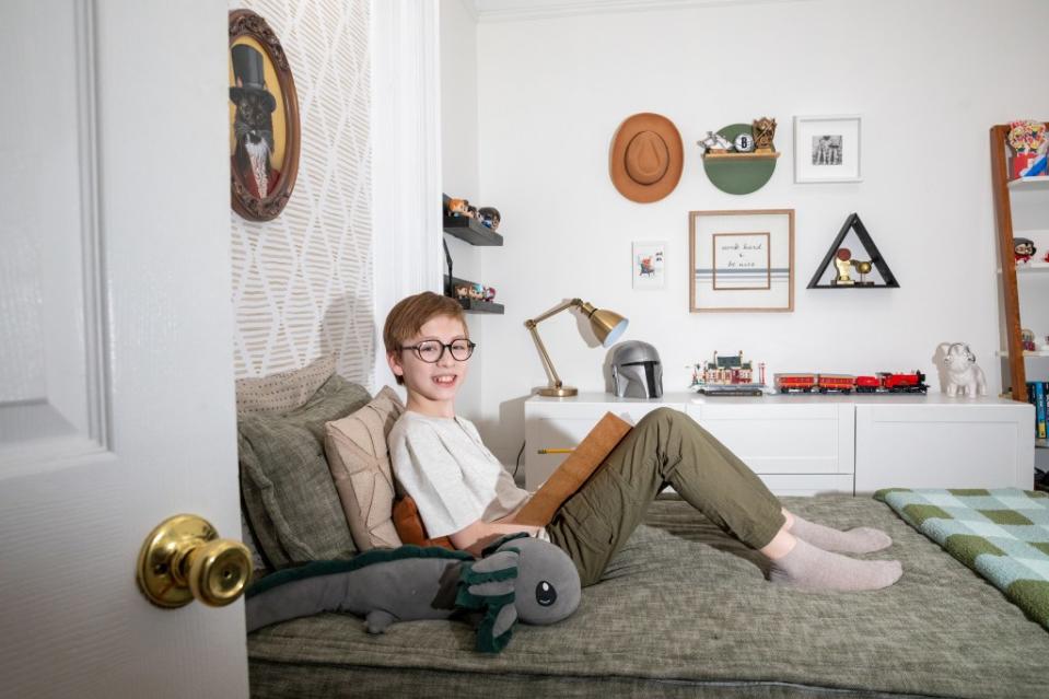 Luke Miller, 11, in his bedroom, which shows his favorite collectibles. OLGA GINZBURG FOR THE NEW YORK POST