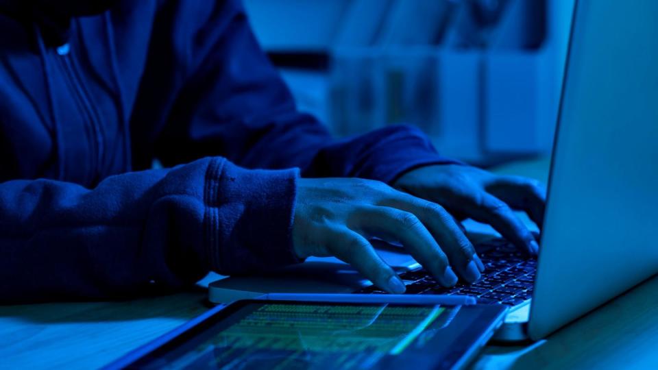 PHOTO: In an undated stock photo, a computer hacker is seen typing on a laptop.  (STOCK PHOTO/Getty Images)