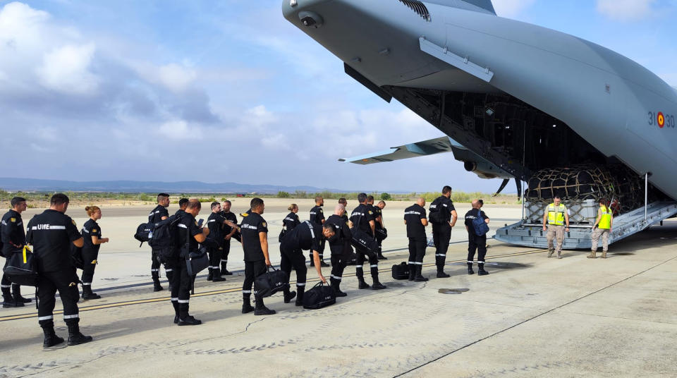 In this photo taken by UME (military emergency unit), a UME military emergency search and rescue unit board a plane at the air base in Zaragoza, Spain, Sunday Sept. 10, 2023 to help with the Earthquake rescue in Morocco. Moroccans worked Sunday to rescue survivors of the nation's strongest earthquake in more than a century. (Spanish Defence Ministry, via AP)