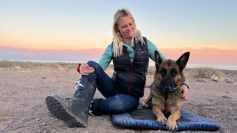 Jess Stone had been riding around the world with her husband Greg and dog Moxie. However, the German Shephard passed away in March. - Greg Stone