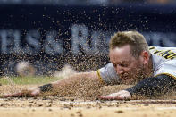 Pittsburgh Pirates' Josh VanMeter scores from first on a two-run double by Diego Castillo against the San Diego Padres during the fourth inning of a baseball game Friday, May 27, 2022, in San Diego. (AP Photo/Gregory Bull)