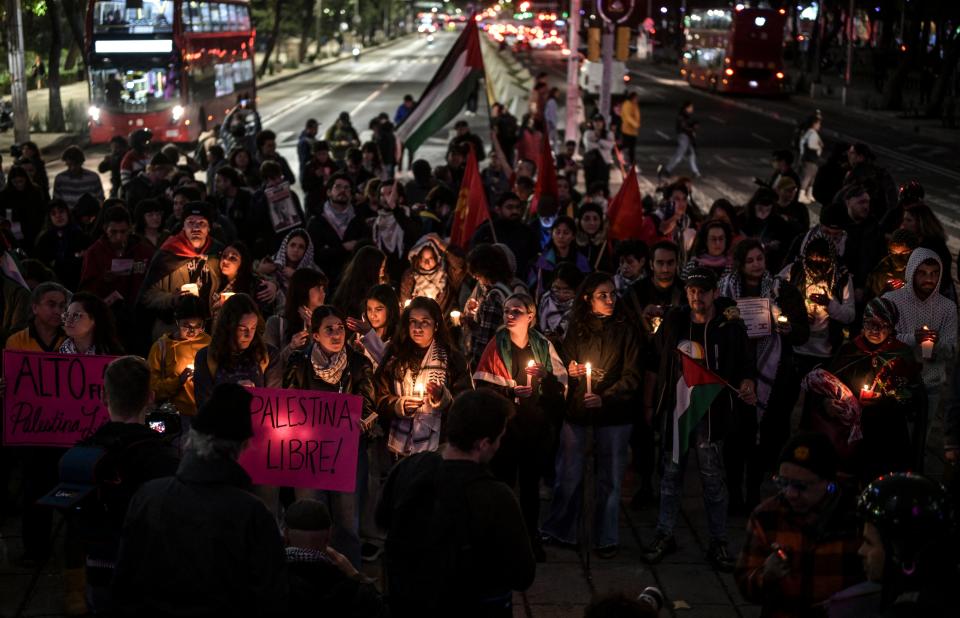 Pro-Palestine activists light candles as they take part in a vigil within the framework of the first anniversary of the Israel-Hamas conflict in Mexico (AFP via Getty Images)