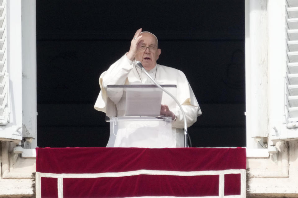 Pope Francis delivers the Angelus noon prayer from his studio's window overlooking St.Peter's Square, at the Vatican, Sunday, Jan. 14, 2024. (AP Photo/Gregorio Borgia)