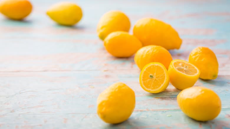 Limequats on a wooden table