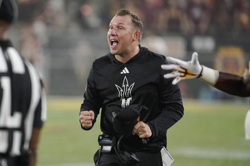 Arizona State head coach Kenny Dillingham celebrates a touchdown against Kansas during the second half of an NCAA college football game Saturday, Oct. 5, 2024, in Tempe, Ariz. (AP Photo/Darryl Webb)