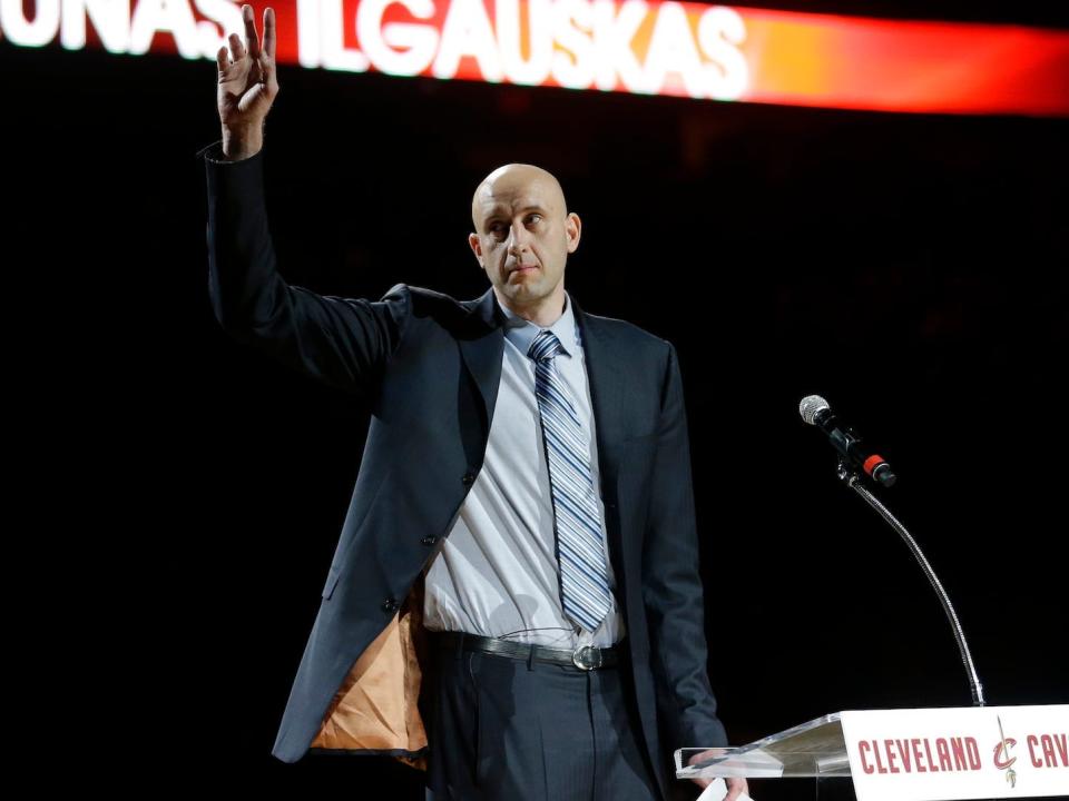 Zydrunas Ilgauskas waves to the crowd during a ceremony in 2014.