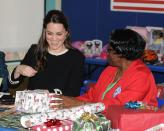 <p>The Duchess of Cambridge helps wrap Christmas presents at the Northside Centre for Child Development in New York City.</p>