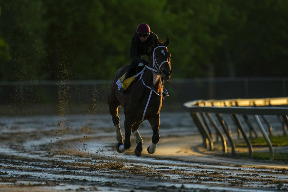 Mud kicks up as Preakness Stakes entrant Uncle Heavy works out ahead of the 149th running of the Preakness Stakes horse race at Pimlico Race Course, Thursday, May 16, 2024, in Baltimore. (AP Photo/Julio Cortez)