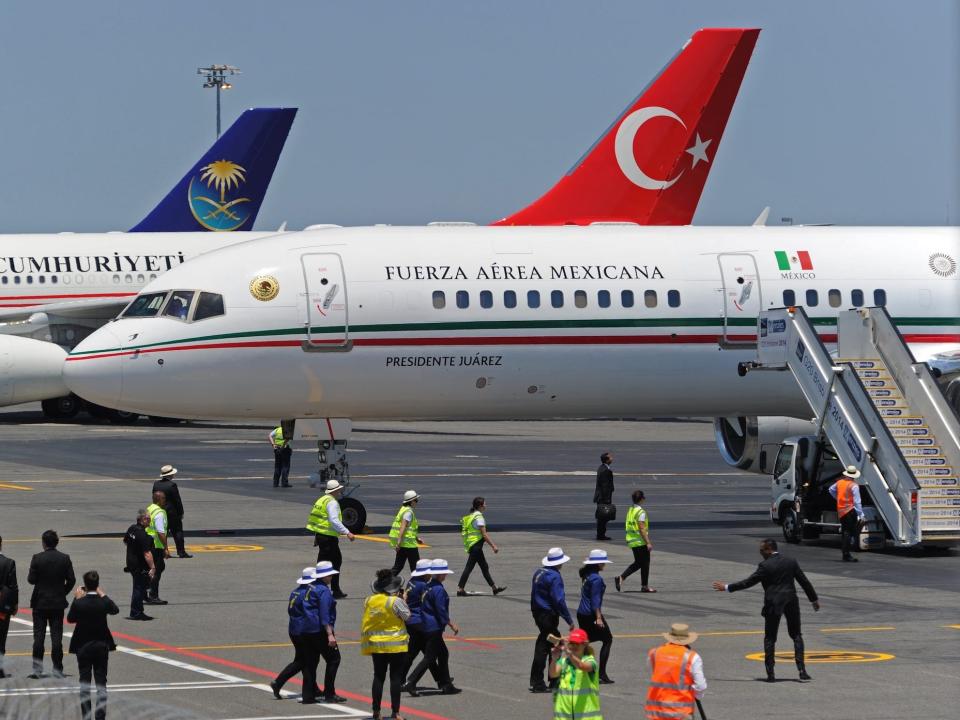 Mexico's presidential Boeing 757 parked with a Turkish Airlines behind it.