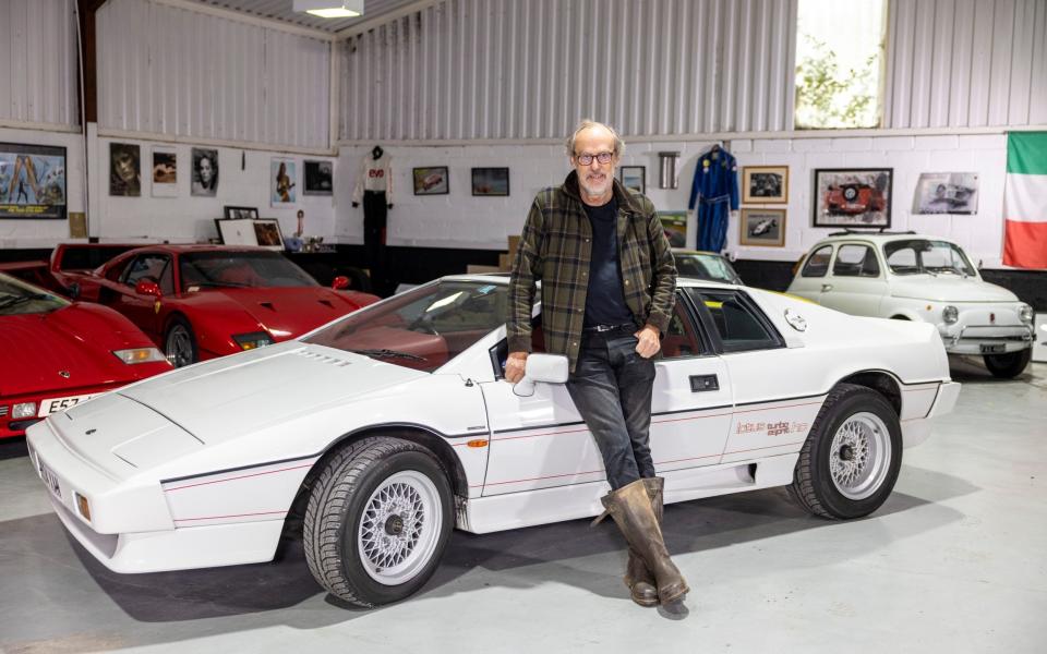 Harry with some of his car collection, including a Lotus Turbo Esprit - Heathcliff O'Malley for The Telegraph