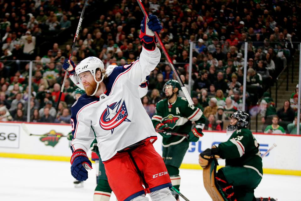 Columbus Blue Jackets right wing Jakub Voracek (93) celebrates his goal as Minnesota Wild goaltender Marc-Andre Fleury (29) and Wild defenseman Matt Dumba (24) look on in the second period of an NHL hockey game Saturday, March 26, 2022, in St. Paul, Minn. (AP Photo/Andy Clayton-King)