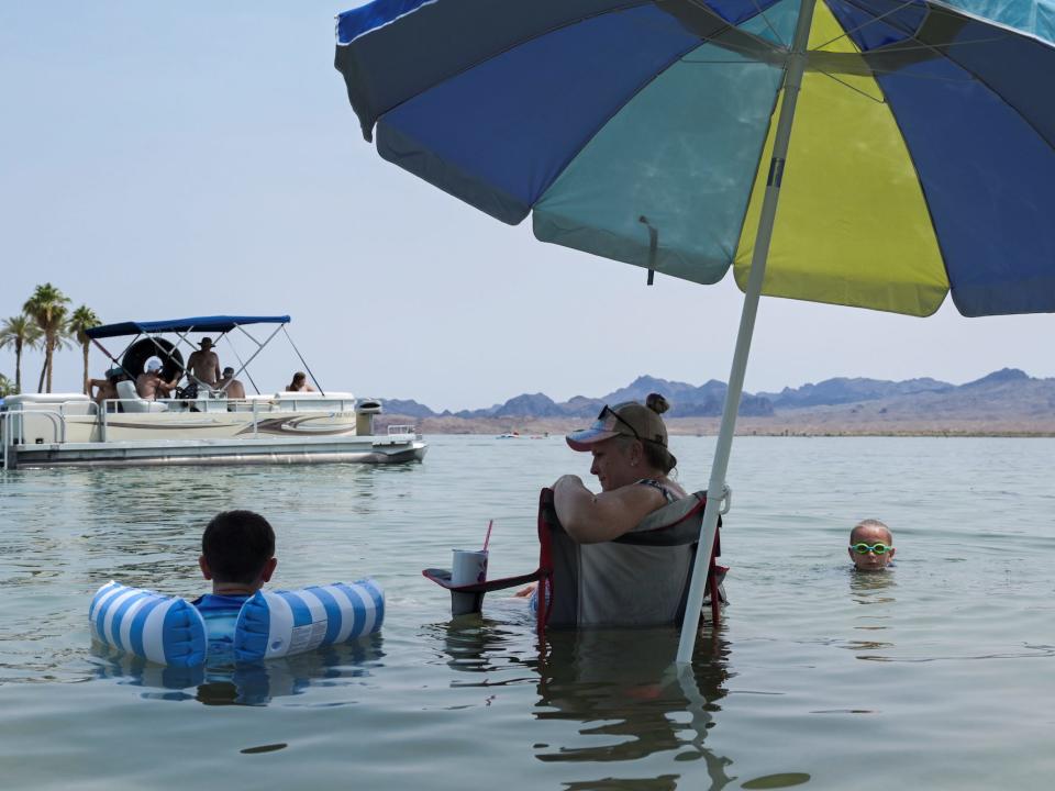 Mary Ann Brown, center, cools off in the water with her grandchildren during a heat wave in Lake Havasu, Arizona, U.S. June 15, 2021.