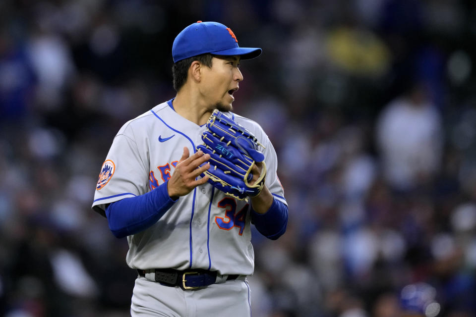 New York Mets starting pitcher Kodai Senga applauds his teammates after the final out in the fourth inning of the team's baseball game against the Chicago Cubs on Wednesday, May 24, 2023, in Chicago. (AP Photo/Charles Rex Arbogast)