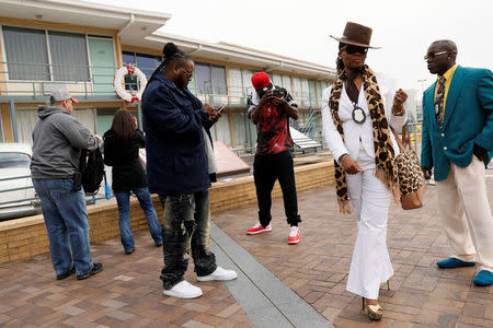 Jerry Coleman (R), a forklift operator by day, takes pictures while he films a scene for his Youtube movie "All Lives Matter" with his friends at the Lorraine Motel, where civil rights leader Martin Luther King Jr. was shot and killed in 1968 in Memphis, Tennessee, U.S., March 26, 2018. Coleman was improvising a scene about what MLK might have thought of the violence on the streets today. "We really want to know what he would think if he was still around. He could be anything, he could be the president right now, we don't know. Whatever's going on in Memphis, I'm on a positive tip. I grew up in a neighbourhood with lots of things going on, but that's not going to stop me from having fun." REUTERS/Jonathan Ernst