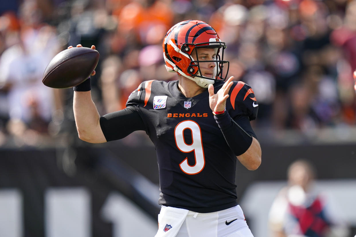 Cincinnati Bengals quarterback Joe Burrow (9) throws against the Green Bay Packers in the first half of an NFL football game in Cincinnati, Sunday, Oct. 10, 2021. (AP Photo/Bryan Woolston)