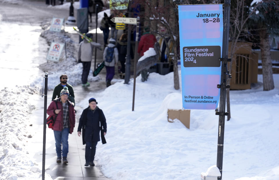 Festivalgoers walk down Main Street on the opening day of the 2024 Sundance Film Festival, Thursday, Jan. 18, 2024, in Park City, Utah. (AP Photo/Chris Pizzello)