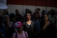 Demonstrators take part in an anti-government protest outside the Central Bank of Lebanon in Beirut