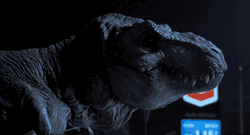 the t-rex roars ink front of a Chevron in "Jurassic Park"