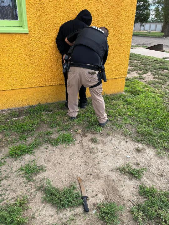 Officer “Pork Chop” Powell apprehending a suspect. The blade on the ground is the knife that was found in the suspect’s sleeve and injured Officer Powell. Courtesy: Rocky Ford Police Department