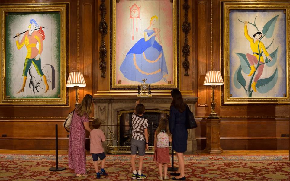 Visitors admire paintings of Dick Whittington, Cinderella and Jack in the Beanstalk - Royal Collection Trust