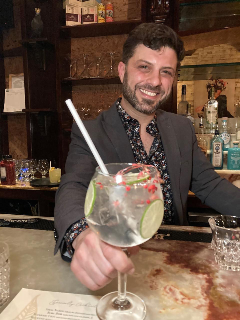 Michael Boulos, owner of  The Raconteur in Pleasantville, with one of the bar's gin drinks. Photographed April 2022.