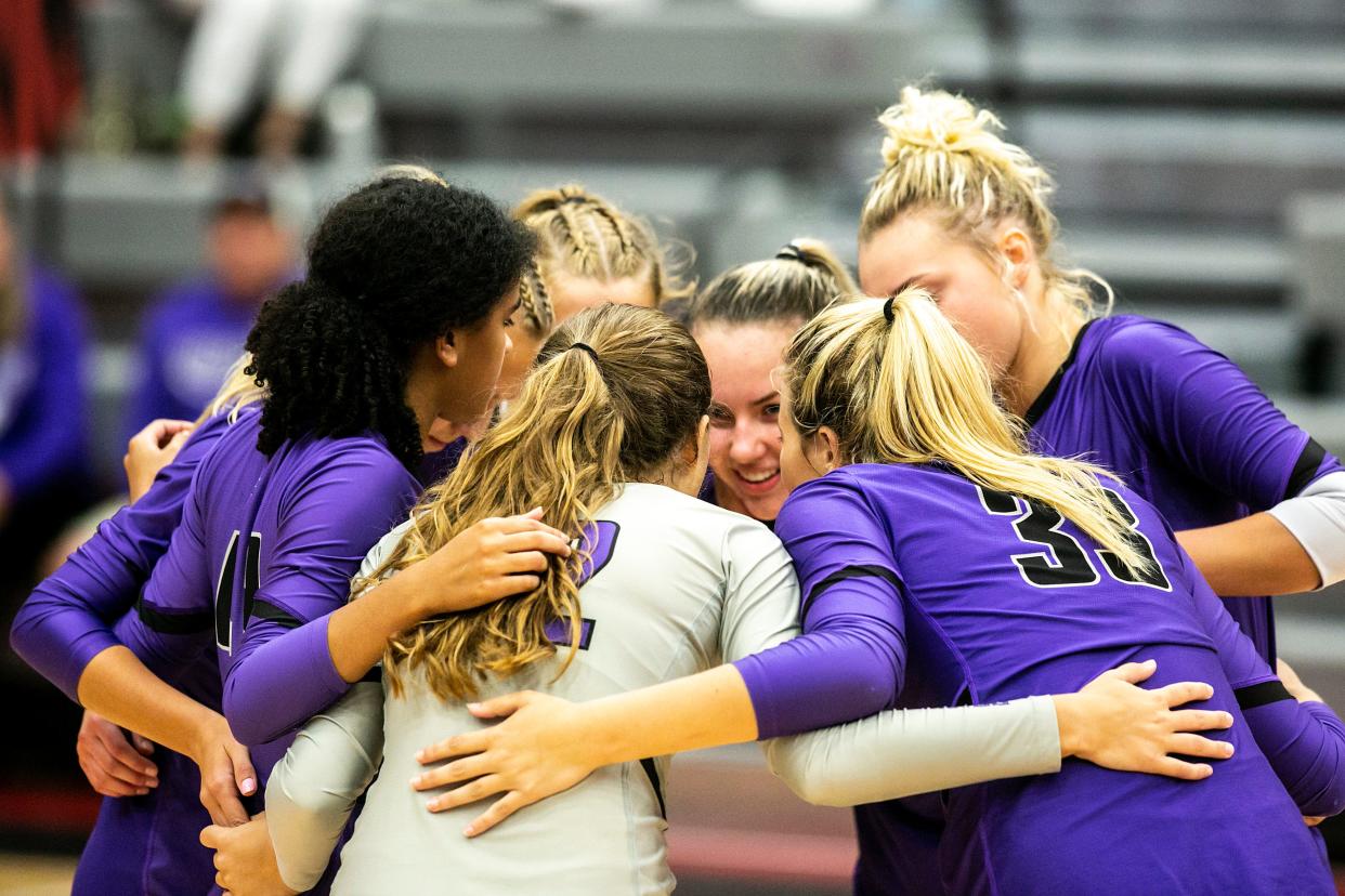 Iowa City Liberty players huddle up during a Class 5A varsity volleyball match against Iowa City High, Tuesday, Aug. 31, 2021, at City High School in Iowa City, Iowa.