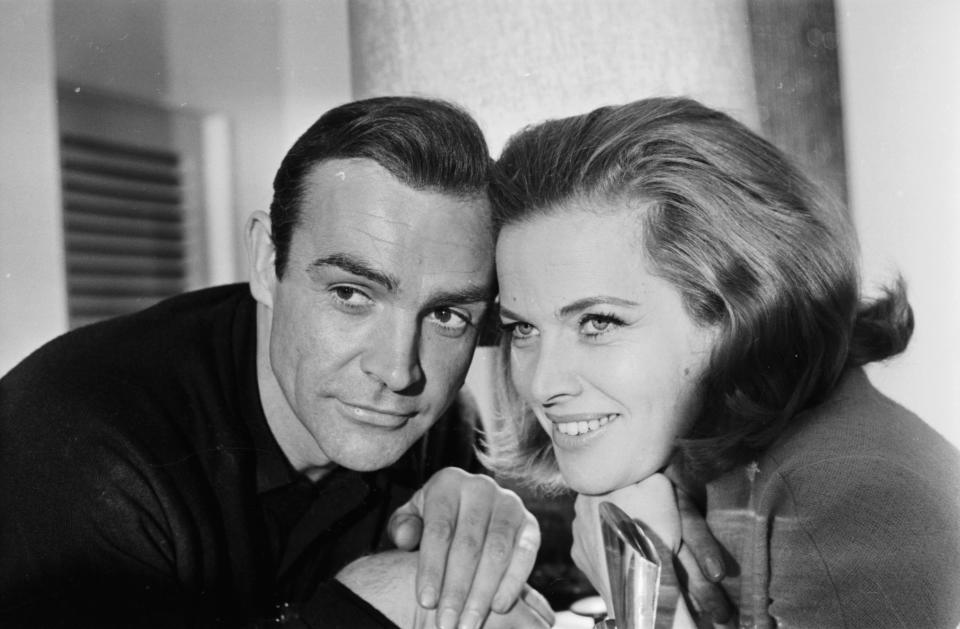 James Bond actors Sean Connery and Honor Blackman pose to promote the film "Goldfinger" in 1964. (Photo by Express/Getty Images)