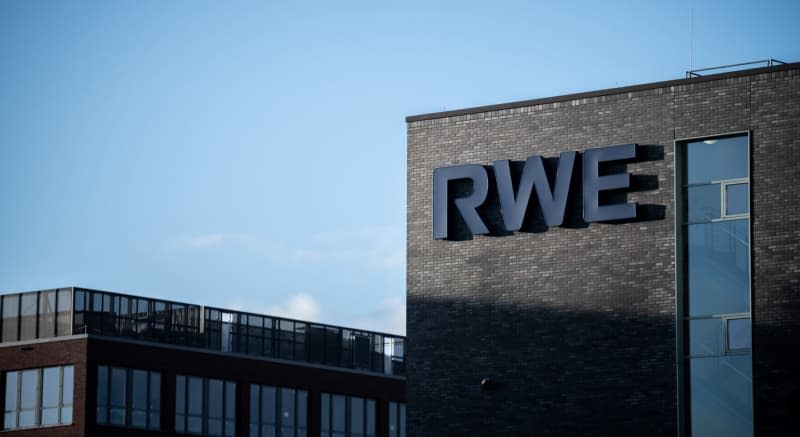 The RWE logo can be seen on the facade of a building on the RWE campus in Essen. Unionized workers at German energy firm RWE will demand raises of at least 12.5% in upcoming collective bargaining talks, the IGBCE and verdi trade unions announced on Thursday. Fabian Strauch/dpa