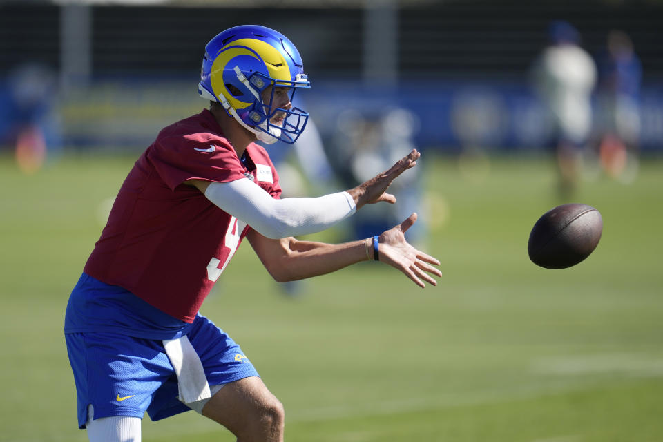 Los Angeles Rams quarterback Matthew Stafford takes a snap during the NFL football team's training camp Wednesday, July 26, 2023, in Irvine, Calif. (AP Photo/Marcio Jose Sanchez)