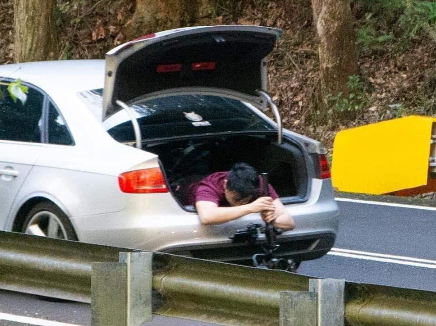 A NSW Police chief inspector has described the stunt, pictured is the man out of the boot, as 'dangerous and selfish'.