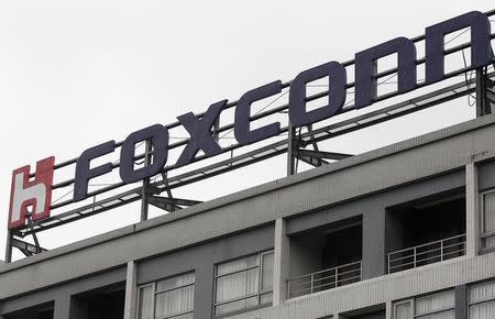 The logo of Foxconn, the trading name of Hon Hai Precision Industry, is seen on top of the company's headquarters in Tucheng, New Taipei city, December 24, 2013. REUTERS/Pichi Chuang